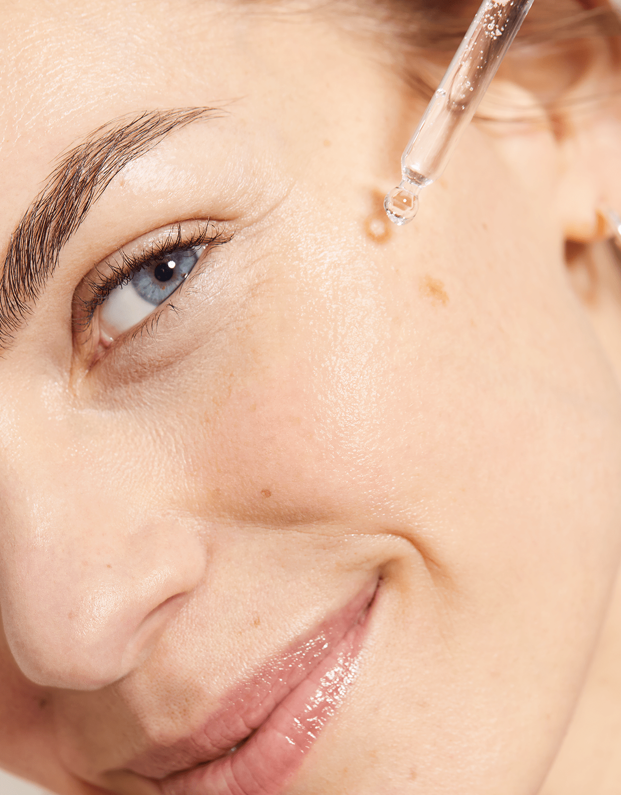 woman applying Nivea Cellular serum